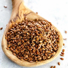 Load image into Gallery viewer, Organic brown flaxseeds linseeds on wooden spoon
